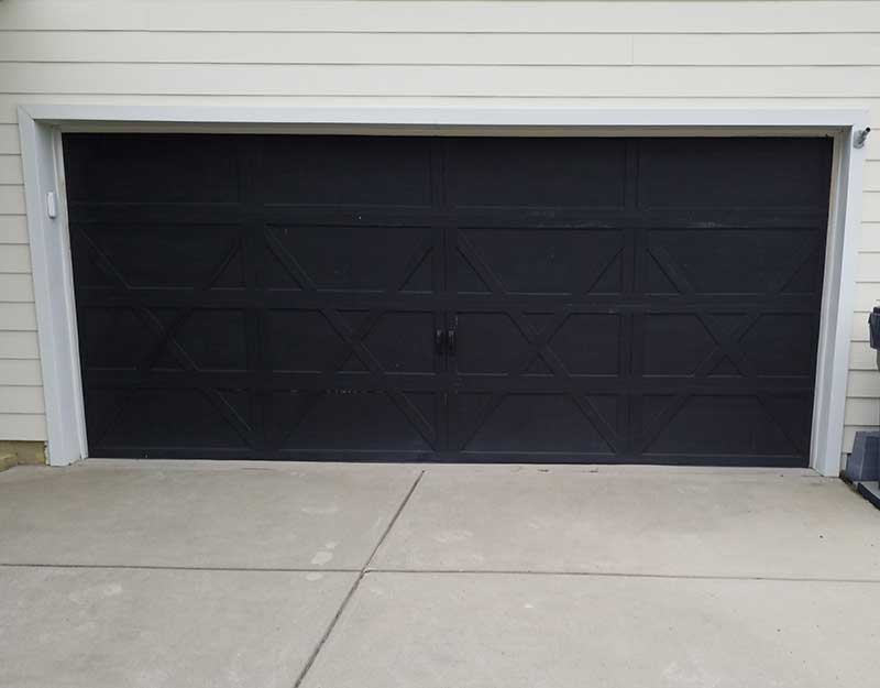 "Before" page of black garage door